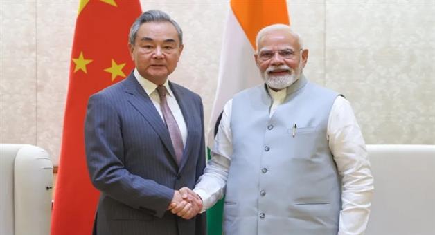 Khabar Odisha:Chinese-Foreign-Minister-Wang-Yi-met-PM-Modi-handed-over-invitation-for-SCO-conference