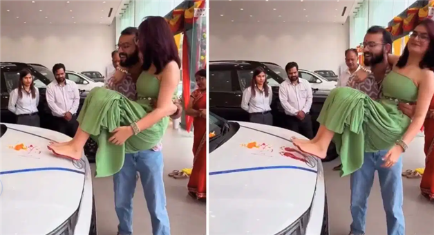 Khabar Odisha:viral-video-husband-takes-wife-footprints-on-new-car-bonnet-social-media-debate